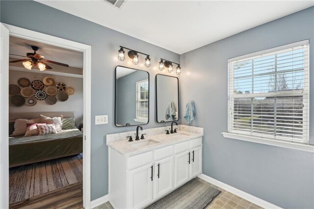 45 Peregrine Ln S, Dawsonville, GA 30534 - bathroom with baseboards, a ceiling fan, ensuite bath, and a sink