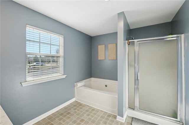 45 Peregrine Ln S, Dawsonville, GA 30534 - bathroom featuring a shower stall, baseboards, and a bath
