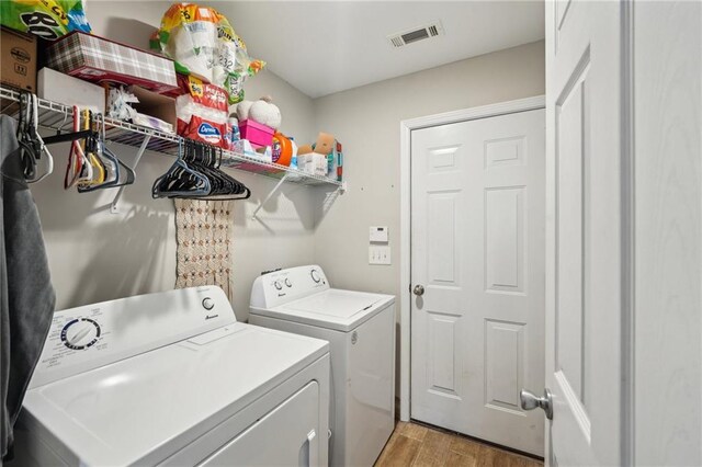 45 Peregrine Ln S, Dawsonville, GA 30534 - washroom featuring independent washer and dryer, light wood-type flooring, visible vents, and laundry area