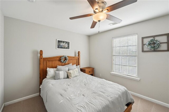 45 Peregrine Ln S, Dawsonville, GA 30534 - carpeted bedroom featuring visible vents, a ceiling fan, and baseboards