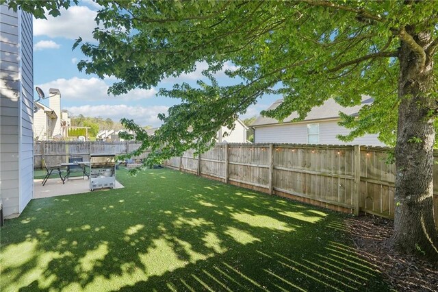 45 Peregrine Ln S, Dawsonville, GA 30534 - view of yard with a fenced backyard and a patio