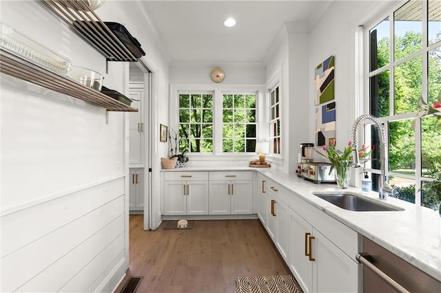 kitchen with a sink, open shelves, white cabinetry, plenty of natural light, and recessed lighting