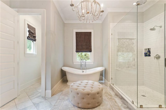 bathroom with a stall shower, a freestanding tub, crown molding, plenty of natural light, and a chandelier