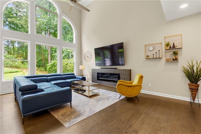 2055 Beacon Hill Way, Alpharetta, GA 30005 - living area with plenty of natural light, ceiling fan, wood finished floors, high vaulted ceiling, and a tile fireplace