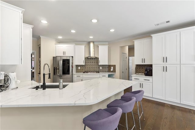 2055 Beacon Hill Way, Alpharetta, GA 30005 - kitchen with wall chimney range hood, stainless steel fridge, a peninsula, crown molding, and recessed lighting