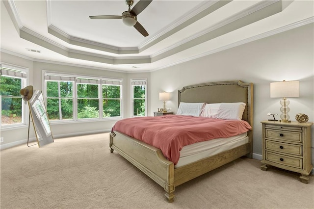 2055 Beacon Hill Way, Alpharetta, GA 30005 - bedroom featuring ornamental molding, light carpet, multiple windows, a tray ceiling, and a ceiling fan