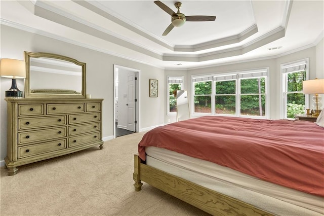2055 Beacon Hill Way, Alpharetta, GA 30005 - bedroom featuring a tray ceiling, ornamental molding, multiple windows, light carpet, and a ceiling fan