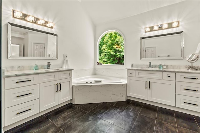 2055 Beacon Hill Way, Alpharetta, GA 30005 - full bath featuring two vanities, a bath, lofted ceiling, and tile patterned floors