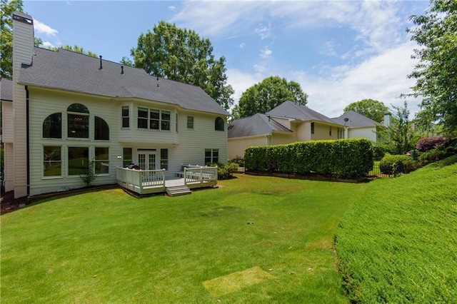 2055 Beacon Hill Way, Alpharetta, GA 30005 - rear view of property featuring a deck, a lawn, and a chimney