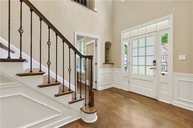 2055 Beacon Hill Way, Alpharetta, GA 30005 - entryway featuring a decorative wall, wood finished floors, wainscoting, and stairway
