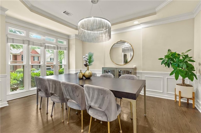 2055 Beacon Hill Way, Alpharetta, GA 30005 - dining room with ornamental molding, dark wood-style floors, a raised ceiling, a decorative wall, and a wainscoted wall