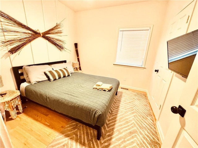 bedroom with light wood-type flooring