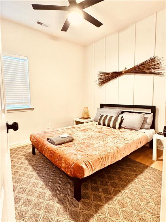 bedroom featuring ceiling fan and light wood-type flooring