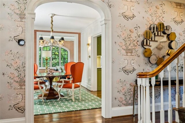 3086 E Pine Valley Rd NW, Atlanta, GA 30305 - living area with wood finished floors, a notable chandelier, arched walkways, ornamental molding, and stairs