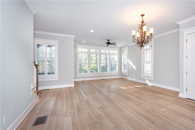 interior space featuring a wealth of natural light, crown molding, light hardwood / wood-style floors, and ceiling fan with notable chandelier