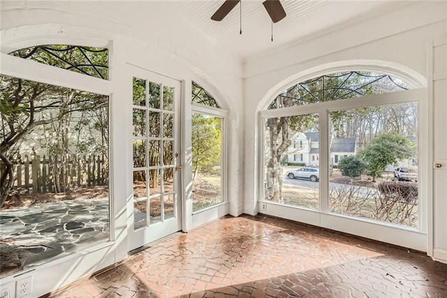 sunroom featuring ceiling fan