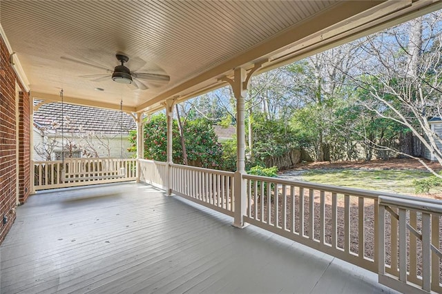 deck featuring a ceiling fan and fence