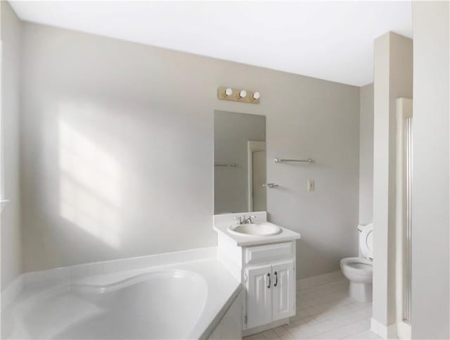 bathroom with vanity, toilet, tile patterned floors, and a tub to relax in