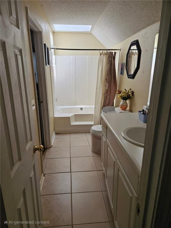 7073 Stonecreek Dr, Douglasville, GA 30134 - full bath with toilet, lofted ceiling, a textured ceiling, tile patterned flooring, and vanity