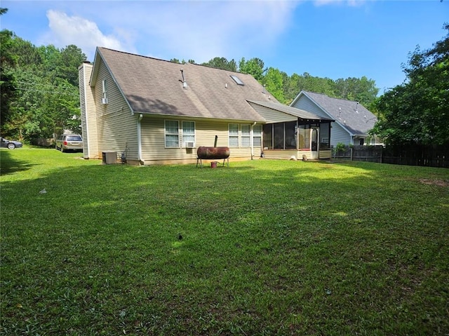 7073 Stonecreek Dr, Douglasville, GA 30134 - back of property featuring a sunroom, central AC, and a chimney