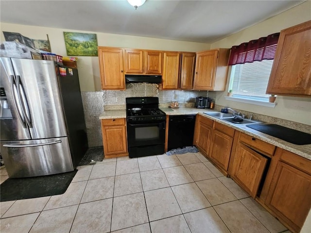 7073 Stonecreek Dr, Douglasville, GA 30134 - kitchen featuring black appliances, under cabinet range hood, a sink, light countertops, and decorative backsplash