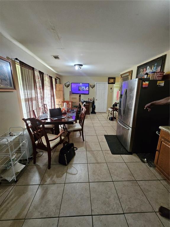 7073 Stonecreek Dr, Douglasville, GA 30134 - dining area with light tile patterned flooring