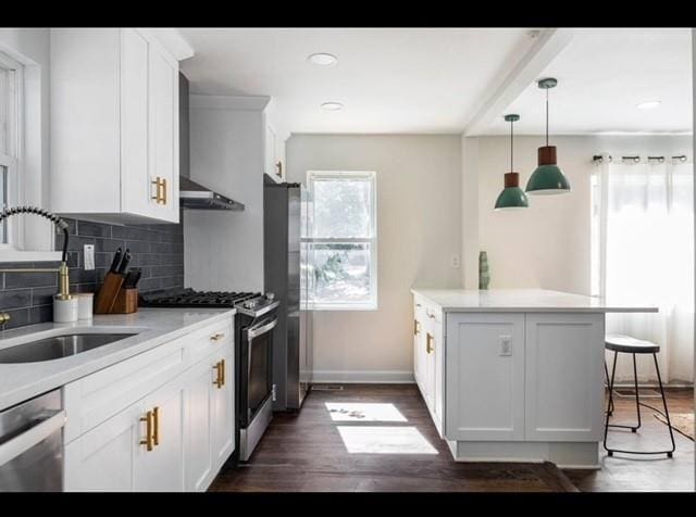 205 Maple St, Atlanta, GA 30354 - kitchen featuring appliances with stainless steel finishes, decorative backsplash, light countertops, dark wood finished floors, and recessed lighting