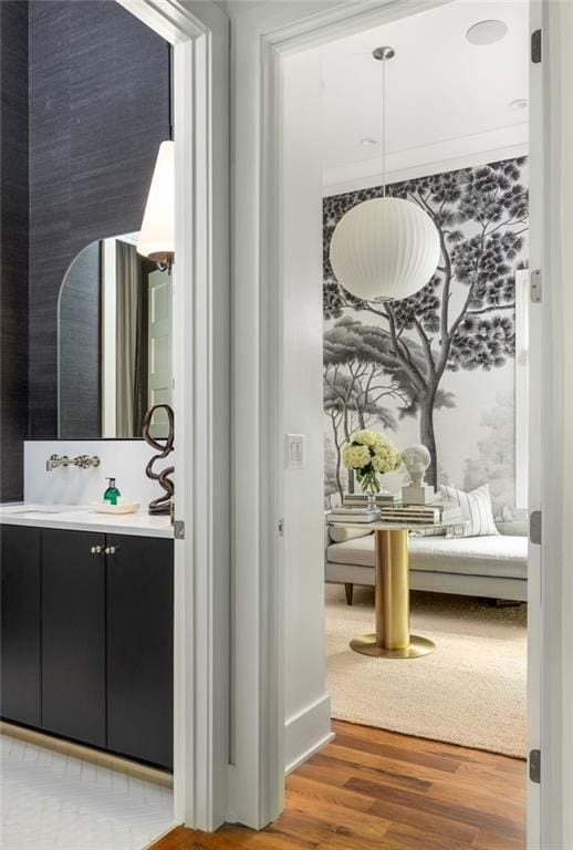 interior space featuring vanity and wood-type flooring