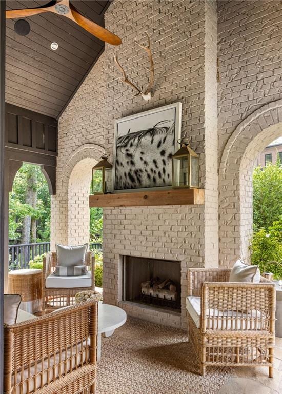 interior space with an outdoor brick fireplace