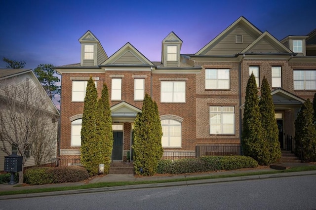 multi unit property featuring brick siding