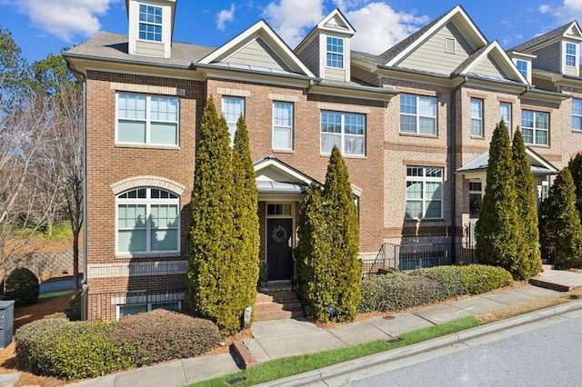 multi unit property featuring brick siding