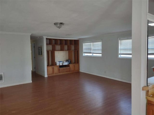 unfurnished living room featuring electric panel, crown molding, and dark hardwood / wood-style floors