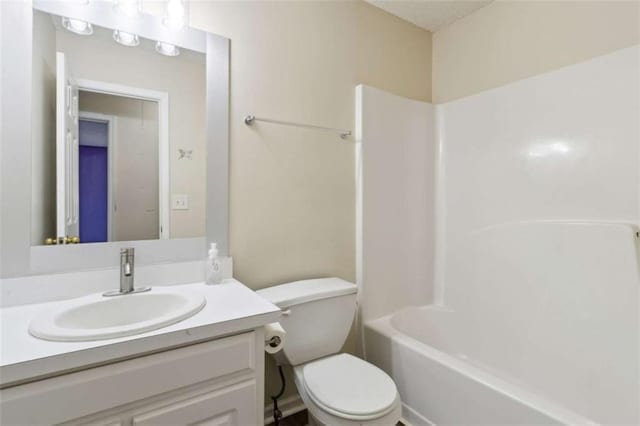 full bathroom featuring shower / washtub combination, toilet, and vanity