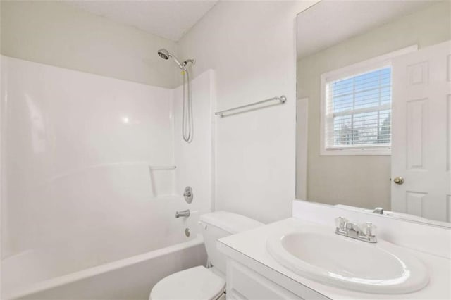 full bathroom with shower / tub combination, vanity, and toilet