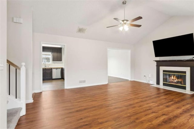 unfurnished living room featuring ceiling fan, high vaulted ceiling, and dark hardwood / wood-style flooring