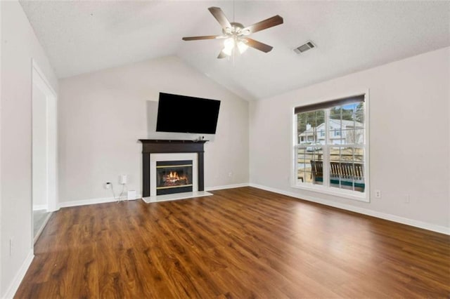 unfurnished living room featuring wood-type flooring, ceiling fan, and lofted ceiling