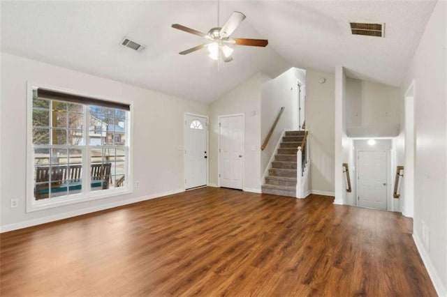 unfurnished living room with vaulted ceiling, ceiling fan, and dark wood-type flooring