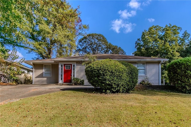 single story home with a front lawn and a carport