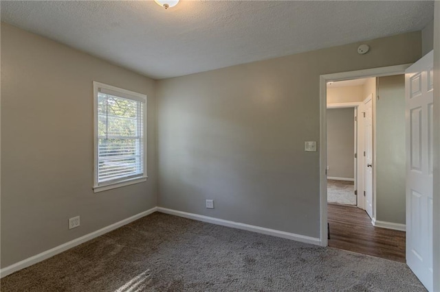 2308 Sheryl Dr, Decatur, GA 30032 - empty room featuring carpet floors, baseboards, a smoke detector, and a textured ceiling