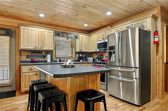 100 Black Oaks Rd, Cherry Log, GA 30522 - kitchen with stainless steel appliances, wood ceiling, dark countertops, a center island, and a kitchen breakfast bar