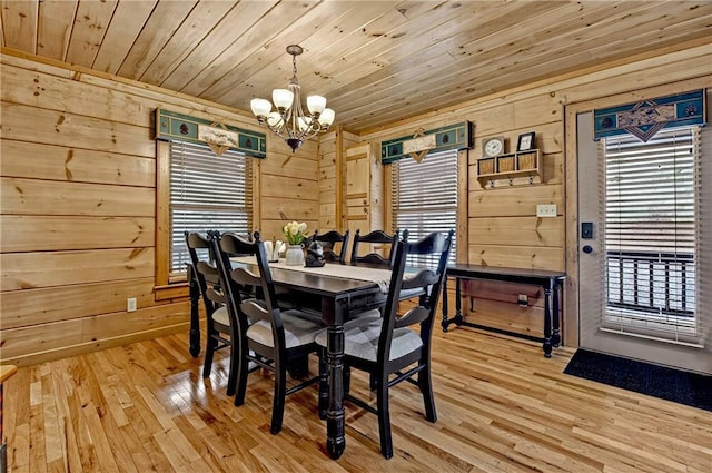 100 Black Oaks Rd, Cherry Log, GA 30522 - dining room featuring a chandelier, wooden ceiling, healthy amount of natural light, wooden walls, and light wood-type flooring