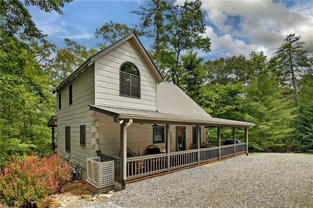 100 Black Oaks Rd, Cherry Log, GA 30522 - view of front of house with a metal roof and driveway