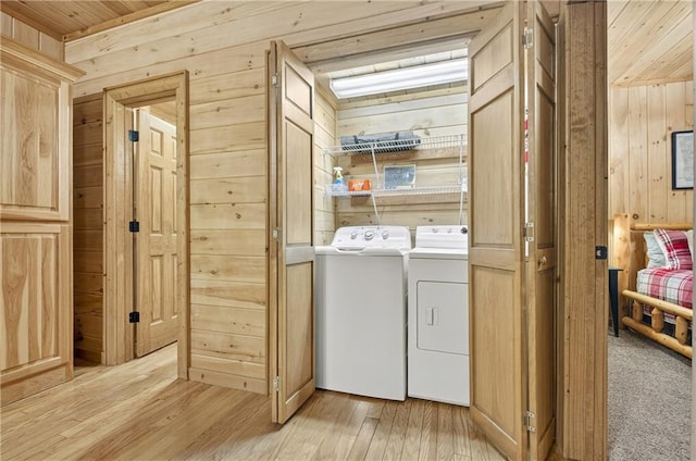 100 Black Oaks Rd, Cherry Log, GA 30522 - laundry room with washing machine and dryer, wooden walls, light wood-type flooring, and wood ceiling