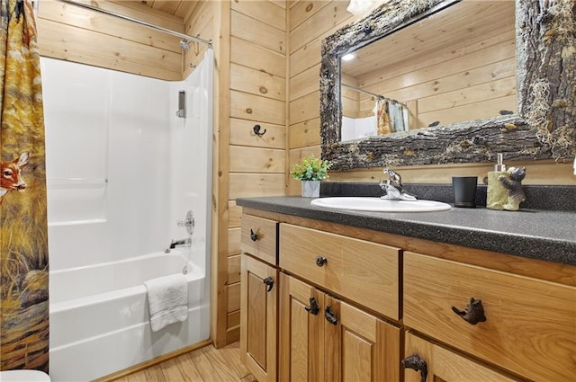 100 Black Oaks Rd, Cherry Log, GA 30522 - bathroom featuring vanity, shower / tub combo, wood finished floors, and wooden walls