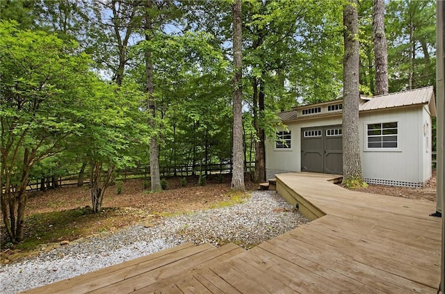 100 Black Oaks Rd, Cherry Log, GA 30522 - wooden deck featuring an outbuilding, a garage, and view of wooded area