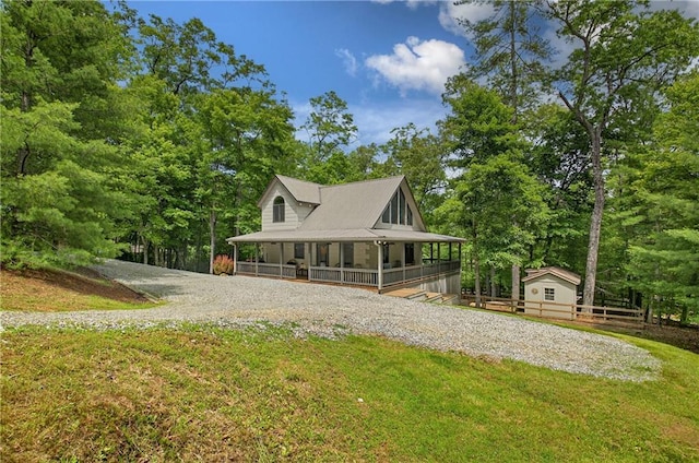 100 Black Oaks Rd, Cherry Log, GA 30522 - country-style home with covered porch, driveway, and view of wooded area