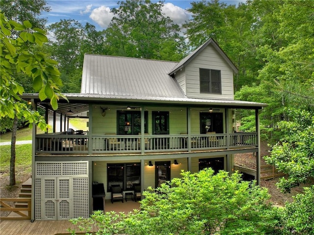 100 Black Oaks Rd, Cherry Log, GA 30522 - rear view of house featuring a metal roof, stairway, and a deck