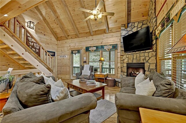 100 Black Oaks Rd, Cherry Log, GA 30522 - living area with a wooden ceiling with exposed beams, wood-type flooring, stairs, ceiling fan, and a fireplace