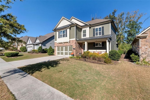 6628 Rivergreen Rd, Flowery Branch, GA 30542 - craftsman inspired home featuring concrete driveway, a front lawn, an attached garage, a standing seam roof, and a porch