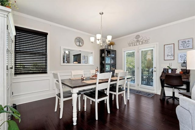 6628 Rivergreen Rd, Flowery Branch, GA 30542 - dining space featuring crown molding, wood finished floors, and a chandelier